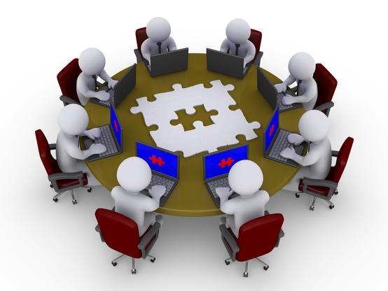 Many people working on the same problem in a collaboration environment on their computers.