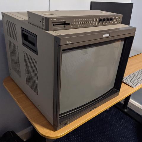 A professional CRT (PVM/BVM) in a well lit room. The screen looks quite gray while off because it was designed for use in an already darkish room for production purposes.