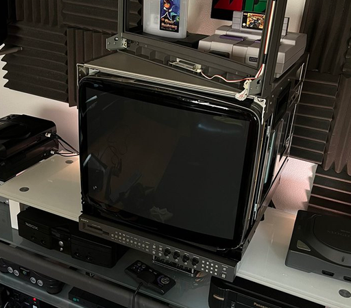 A Sony BVM with the front bezel removed and with 35% VLT film applied to enhance the blacks of the display. It looks significantly closer to black while off.