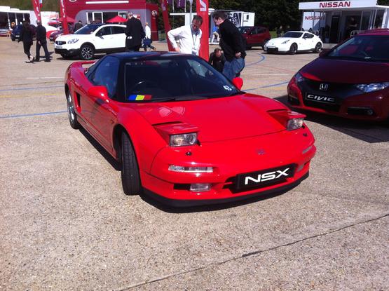 Red first-generation Honda NSX, front quarter view