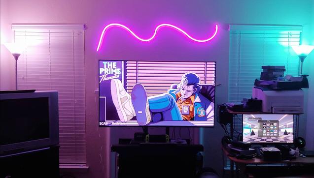 living room with LoFi inspired pink and teal lighting.
