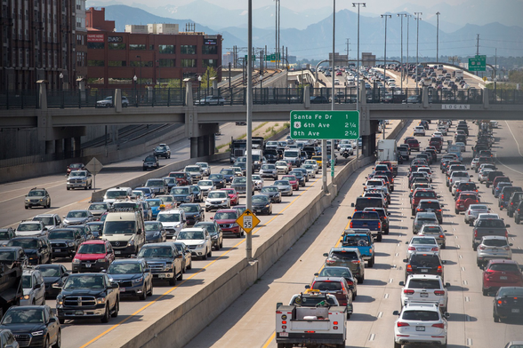 Denver freeway traffic jammed in both directions, 8 lanes.