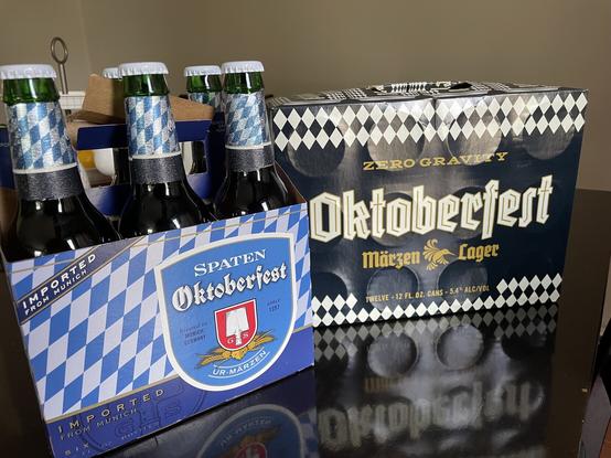 6 pack of Spaten Oktoberfest sitting next to a 12 pack of Zero Gravity’s Oktoberfest