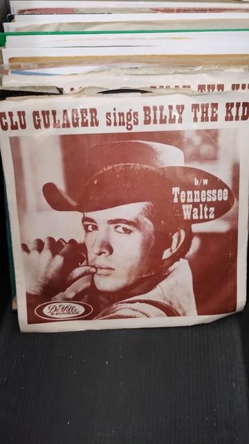 Black and white photo of a cowboy looking back over his shoulder as cover to a vintage seven inch single