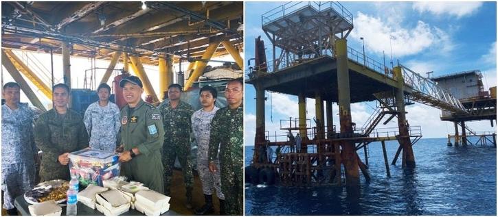 WELCOME BREAK | Soldiers assigned to the Nido observation post, a former gas platform turned over to the Armed Forces of the Philippines in 2019, are treated to food on Aug. 22, 2023, by visiting officers of the Western Command.  (Photo by FRANCES MANGOSING / Philippine Daily Inquirer