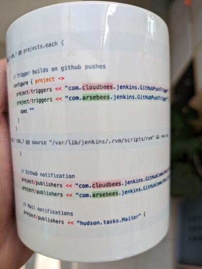 A mug printed with the diff from a github commit