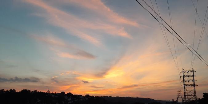 Evening sunset sky with pink and orange clouds