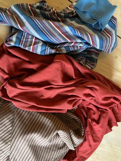 Top to bottom: teal multistripe knit fabric with coordinating ribbing; rust red; cocoa/nut brown ministripe