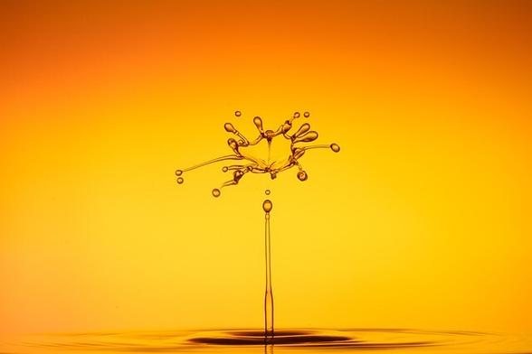 Splash of water against fiery yellow and orange background