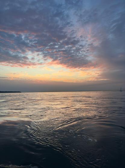 Sunset on a calm Solent sea with wonky horizon