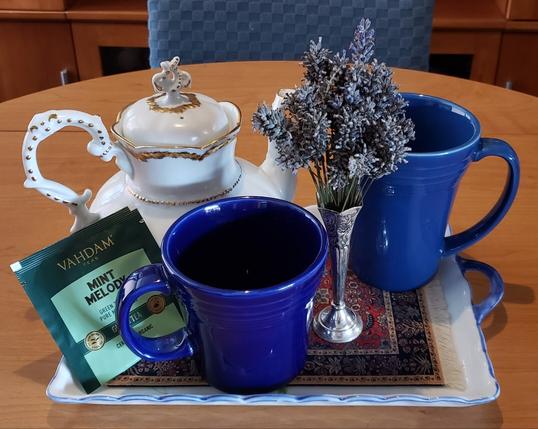 A simple tea tableau with mint green tea and lavender.