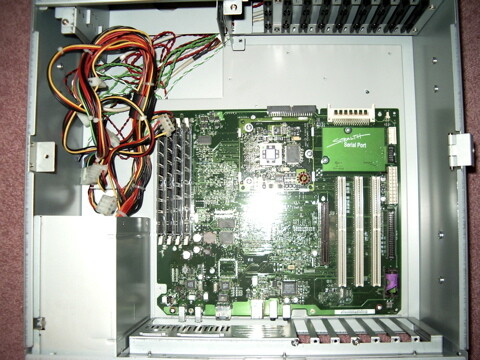 The logic board of a "Sawtooth" PowerMac G4 mounted inside a 4U rackmount ATX case.