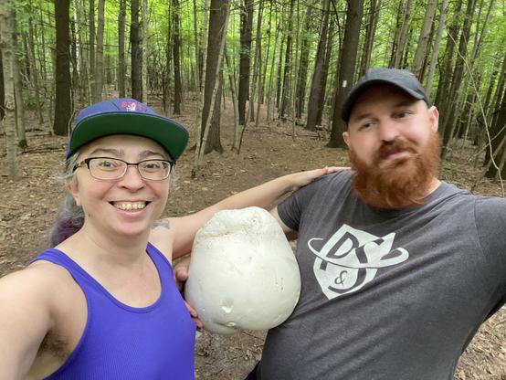 Kyle and I proudly holding our forest foundling, a puffball mushroom the size of a volleyball.