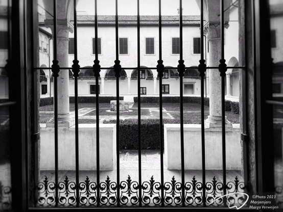 View on patio through the fence of a former convent.