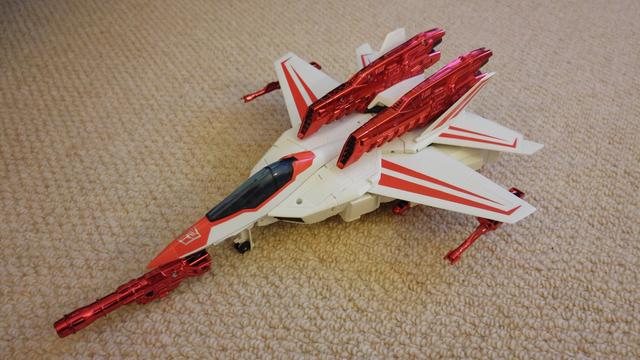 Thrilling 30 Jetfire in his rather beautifully sleek white and red swing-wing jet mode (I think based in this case on the F-14 Tomcat fighter), with his shiny chromed weapons and booster engines.