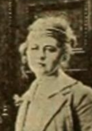 Mary Agnes Moore, from a 1917 publication; a young white woman with light-colored hair, wearing a light-colored jacket