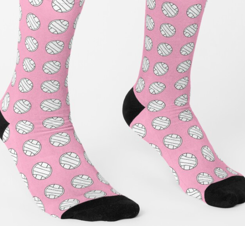 Volleyballs with a pink background are shown on socks.