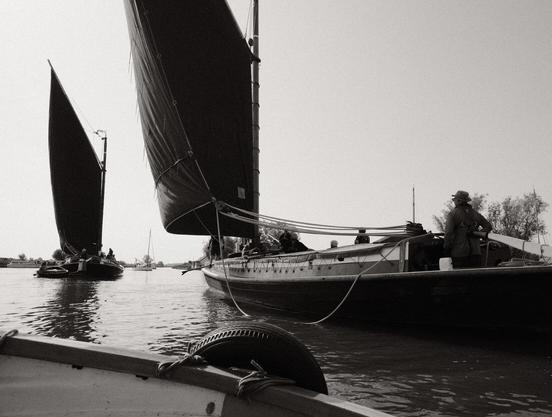 Approaching the wherry Albion from a motor dinghy, with another wherry, the Maud, in the background.