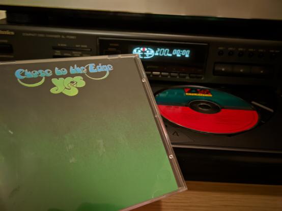 Me holding the jewel case in front of the CD tray, this CD being in the right slot.
