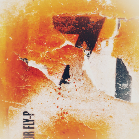Abstract of a ripped orange poster in Bristol