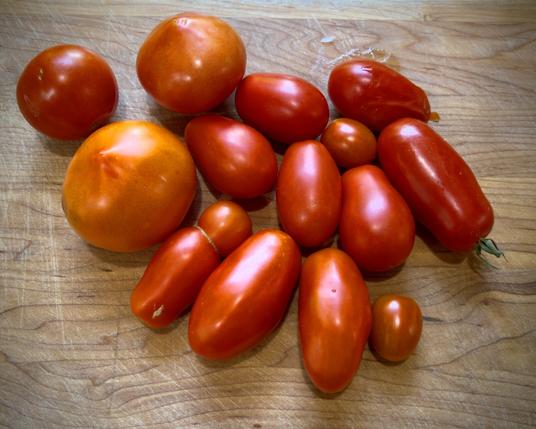 San Marzano tomatoes on wooden cutting board
