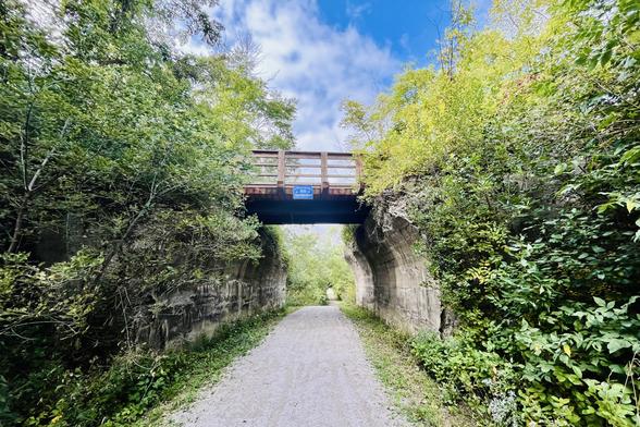 Two steam era rail lines crossed here, but there was no interchange as they were unfriendly. We’re on the G2G trail about to pass northwest under the former London, Huron and Bruce Railway situated northeast-southwest which itself passes over a lovely stone viaduct just to the right that we shall see shortly.