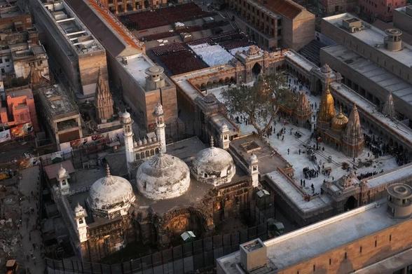 An aerial view shows Gyanvapi mosque (left) and Kashi Vishwanath temple on the banks of the Ganges River in Varanasi, India.