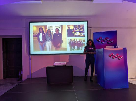 Picture shows Domitil on stage, and three pictures on the slide of her first PyCon Namibia.