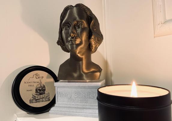 Pictured is a bust of Mary Shelley with a lit candle (Mary by Scent From Hell, a tribute fragrance in honor of Mary Shelley). Photo by AHS.