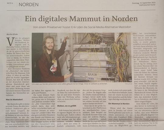 Ein Bild von einem Zeitungsartikel auf dem Erik Uden zu sehen ist mit der Aufschrift „Ein digitales Mammut in Norden”. Einen genauen Alt-text vom Inhalt des Artikels lässt sich als erstes Kommentar auf diesen Beitrag finden.