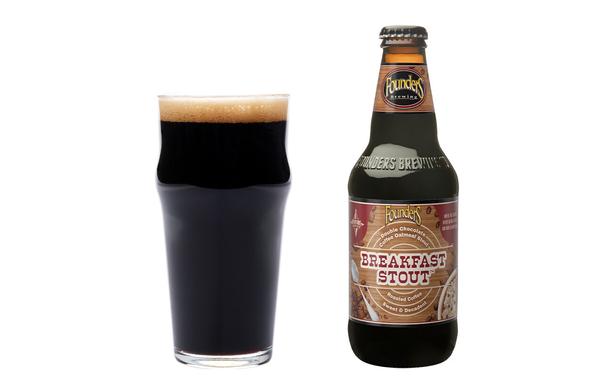 Double Chocolate Coffee Oatmeal Breakfast Stout in a glass next to an unopened bottle of the same