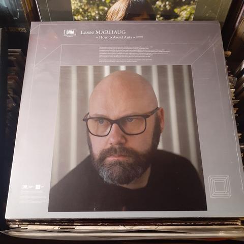 Back album cover features photo of Lasse Marhaug, looking rather intense.  Probably thinking about how to avoid ants.