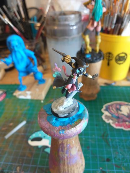 A partially painted harlequin solitaire miniature