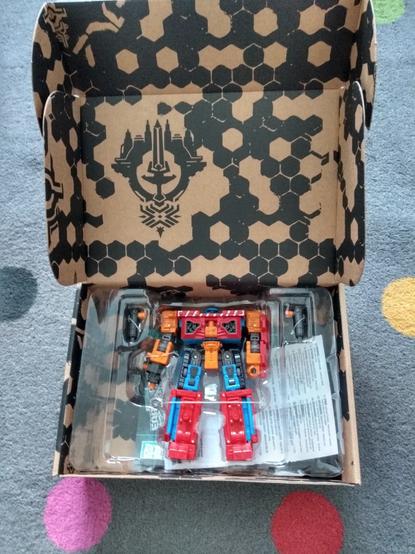The freshly-opened box of the Transformers Generations Selects Hot House toy, showing the robot and it's accessories.