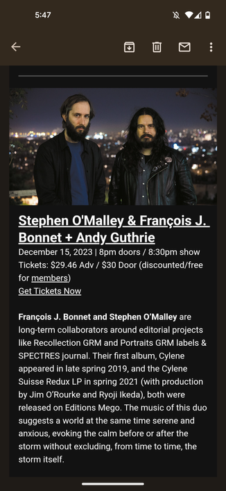 A picture of the event photo. Two Beardy Men scowl.