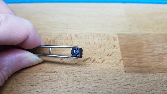 de-soldered Kailh "square" switch of a Logitech G Pro Mouse