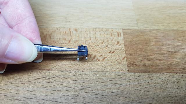 de-soldered Kailh "square" switch of a Logitech G Pro Mouse
