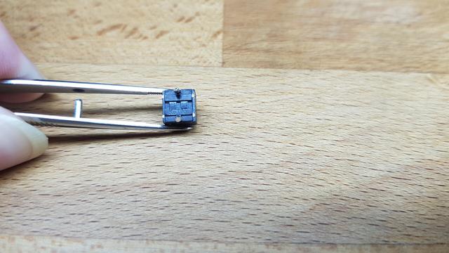 de-soldered Kailh "square" switch of a Logitech G Pro Mouse