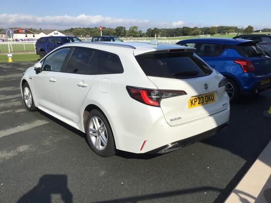 White Suzuki Swace, rear quarter view