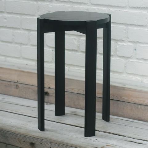 A poplar stool with a black finish.