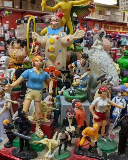 Photo of a display of various plastic action figures in a store