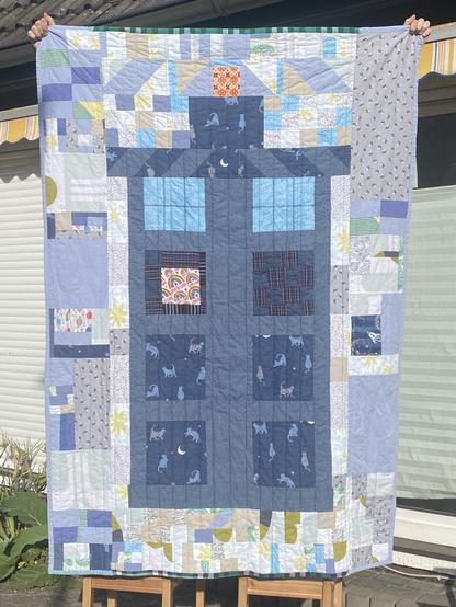 A patchwork quilt depicting the police box or tardis, from doctor who