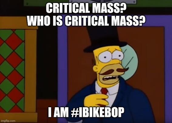 Picture of Homer Simpson with a Moustache. Homer is wearing a suit and tie and his dress is finished with a top hat. There is text at the top of the image which reads "Critical Mass? Who is Critical Mass?" There is text at the bottom that reads "I am #IBIKEBop"