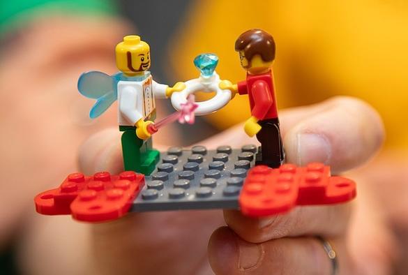 (Photo credit: Hailey Hoffman/Cascadia Daily News) 

Description from Cascadia Daily News article: Mike Tarrant proposed to Brad Bergman by creating a proposal from Legos of the couple. Bergman's minifig dons wings and a wand for his moniker "Brick Fairy," which he used when he ran his toy store in Everett.