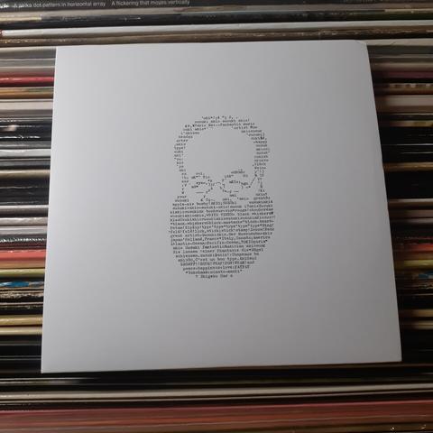 CD cover features an illustration of Akio Suzuki, with a large beard and spectacles, composed of typewritten words and letters.