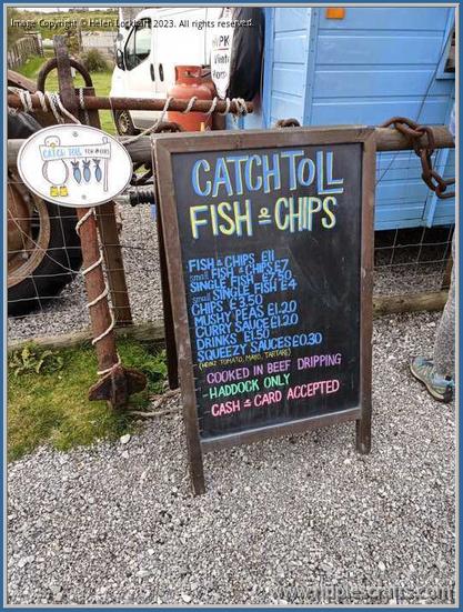 A sign which reads:
CatchToll Fish and Chips with a menu listing what is available.