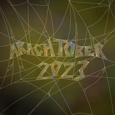 An illustration of the "Arachtober 2023" written in spider web back lit by sunlight.