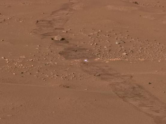 zoomed in view on the bright pebble that was crushed by perseverance's wheels