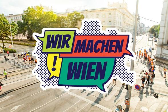 Wir machen Wien Logo vor Hintergrund einer Straßenaktion von Platz für Wien