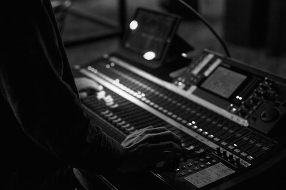 My hands on the LS9 mixer faders.
